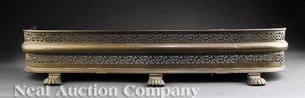 An Antique Pierced Brass Fire Fender