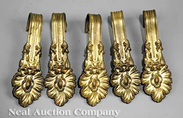 Ten Victorian Pressed Brass Tiebacks