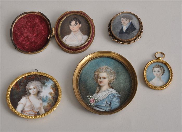 FOUR PORTRAIT MINIATURES IN GILT-METAL