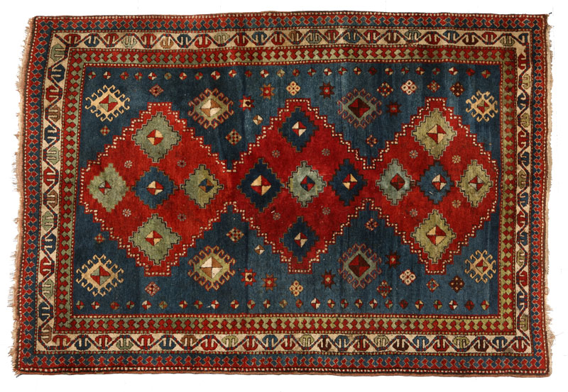 An antique Caucasian Kazak rug
