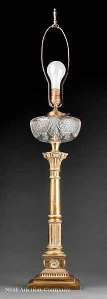 A Brass and Cut Glass Lamp in the