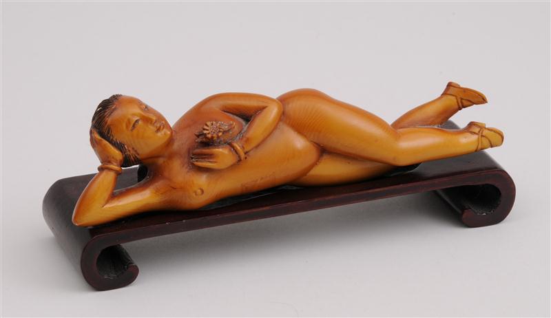 CHINESE CARVED AND BROWN-STAINED IVORY