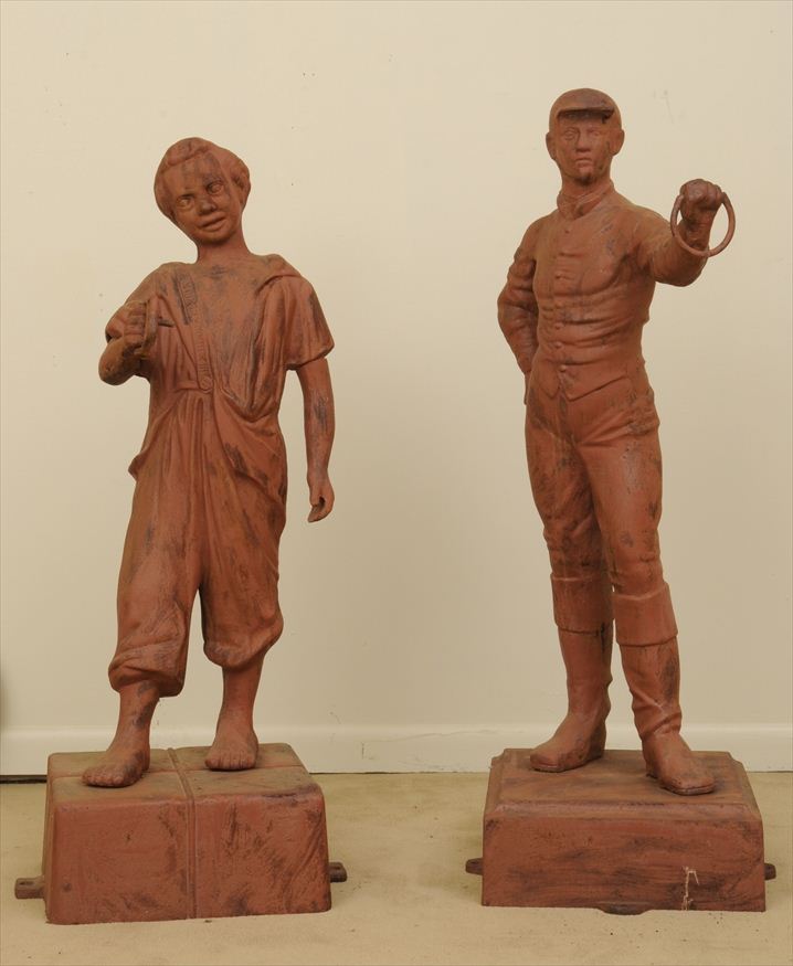 TWO RED-PAINTED CAST-IRON FIGURAL