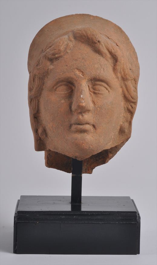 ETRUSCAN MOLDED TERRACOTTA HEAD OF A