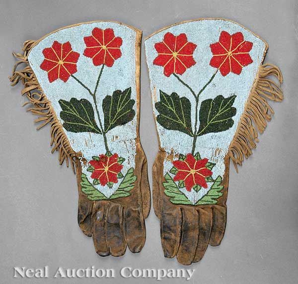 A Pair of Plateau Beaded Hide Gauntlets