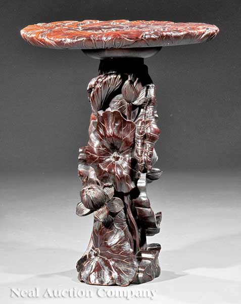 A Chinese Carved Hardwood Table of stylized