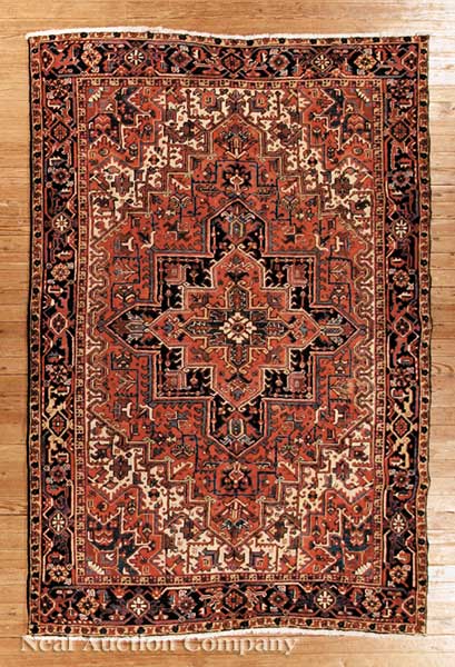A Persian Heriz Carpet red ground 141cf6