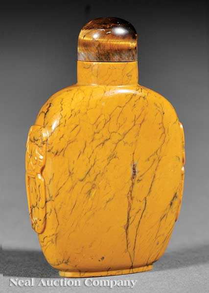 A Chinese Carved Yellow Sandwich Glass