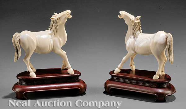 A Pair of Chinese Ivory Figures of Horses