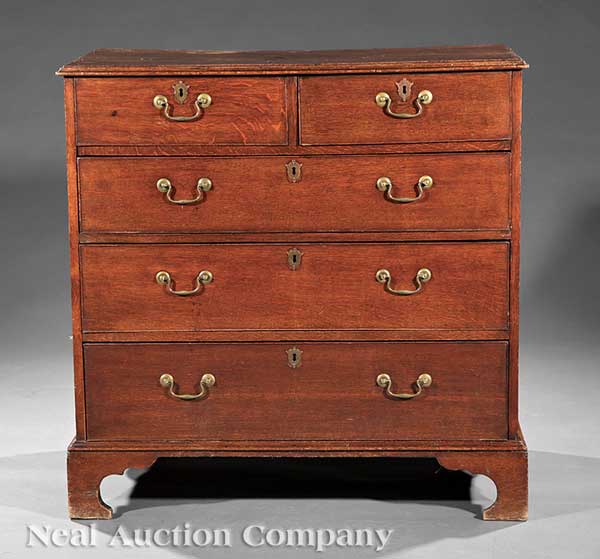 A Georgian Carved Oak Chest of