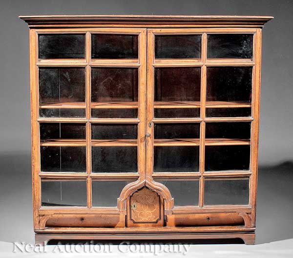 A Swiss Carved Wood Display Cabinet