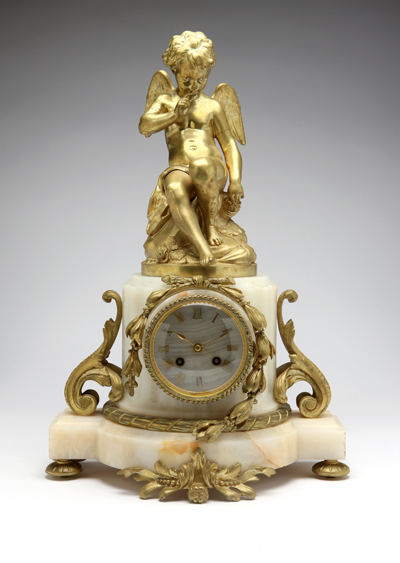 A French gilt bronze and alabaster mantle