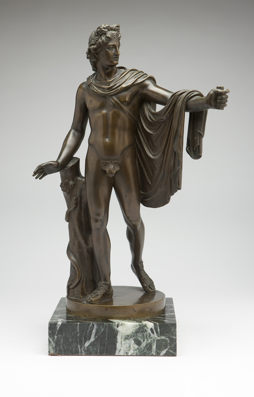 A patinated bronze figure of an