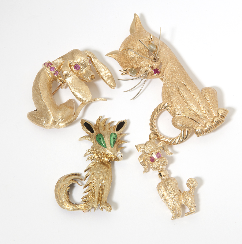 A collection of four gold and gem set 142307