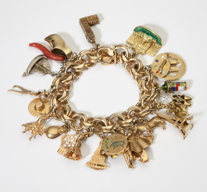 A gold charm bracelet 14K suspending 142317