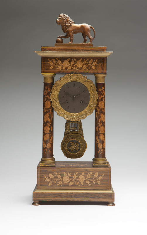 A French marquetry portico mantle clock