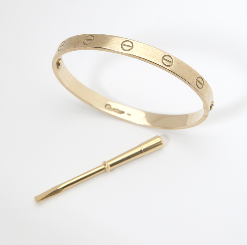 A gold ''Love'' bangle by Cartier