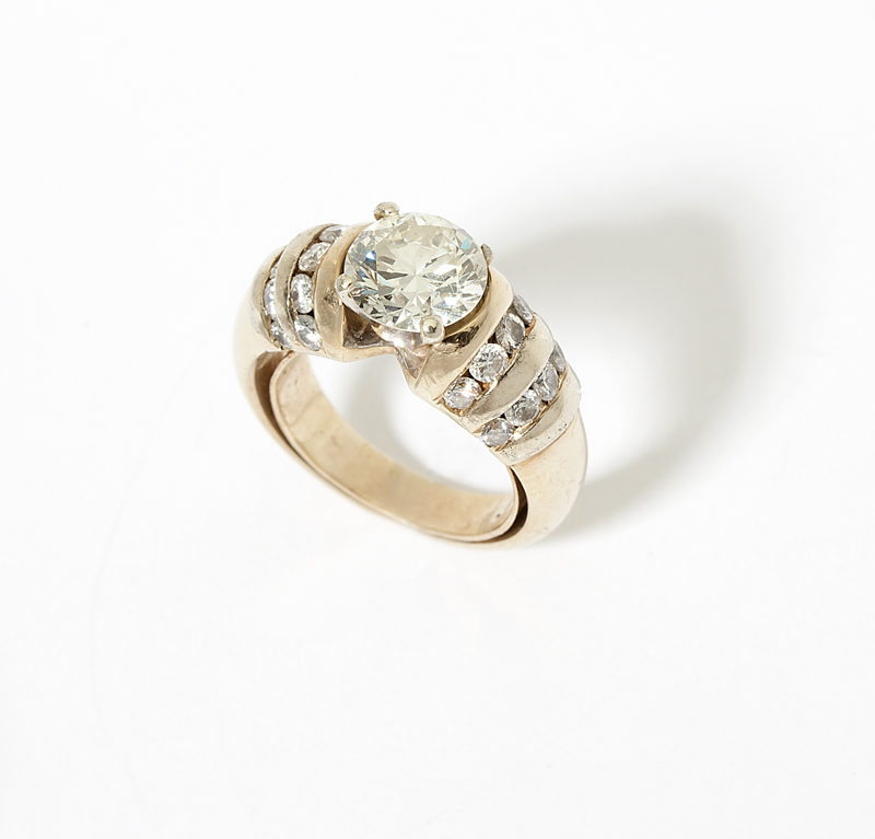 A diamond and gold ring Stamped