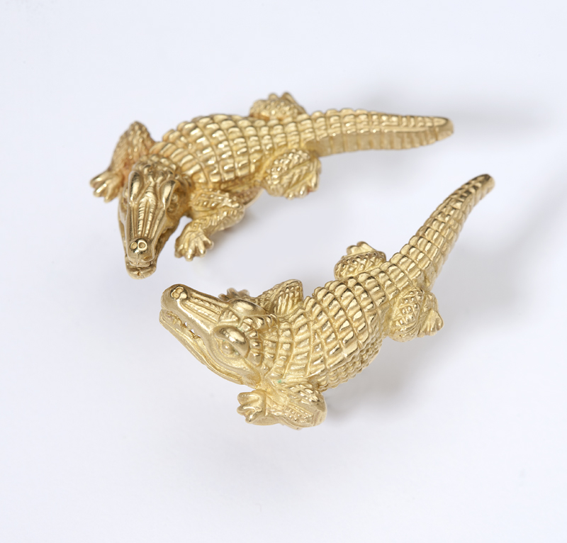 A pair of gold crocodile earrings