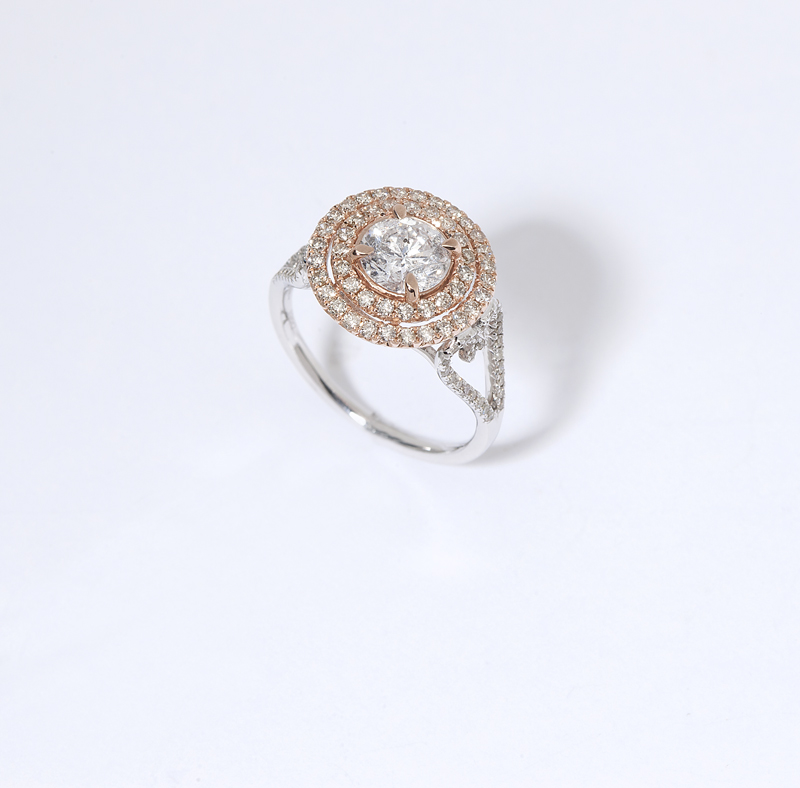 A diamond and bicolor gold ring