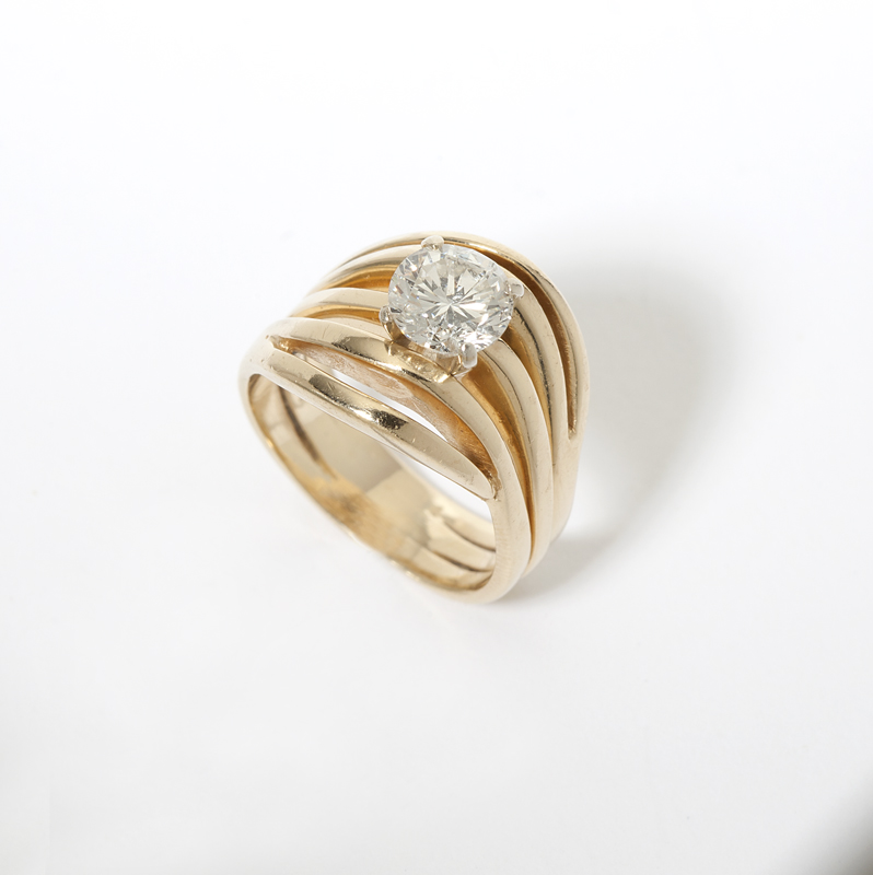 A diamond and gold ring 14K gold centering