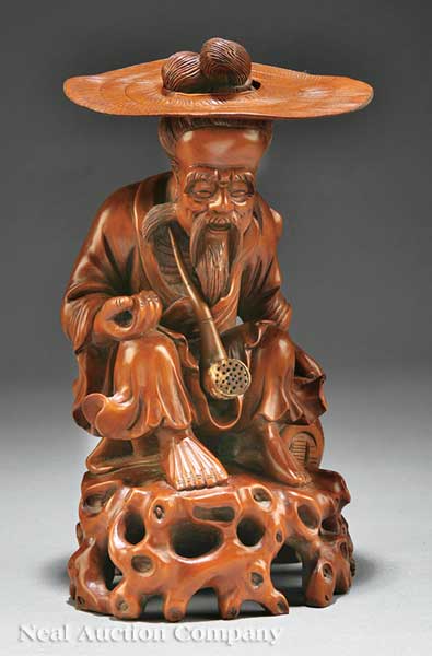 A Chinese Carved Wood Figure of an Old