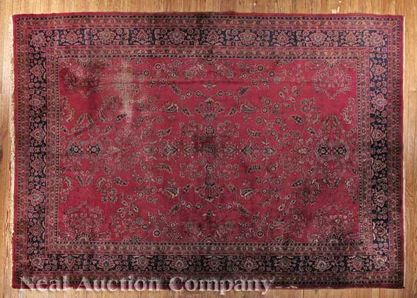 A Large Sarouk Carpet red ground