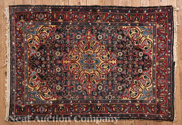 An Antique Persian Rug red and