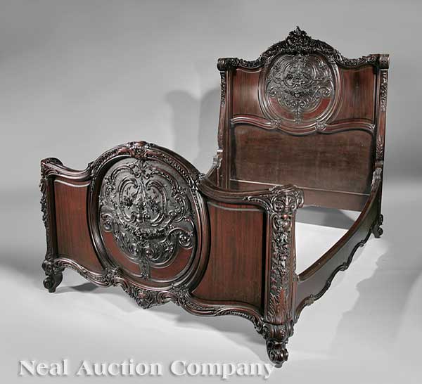 An Antique Carved Mahogany Four-Piece