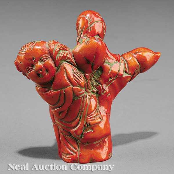 A Chinese Coral Figure of a Young Boy