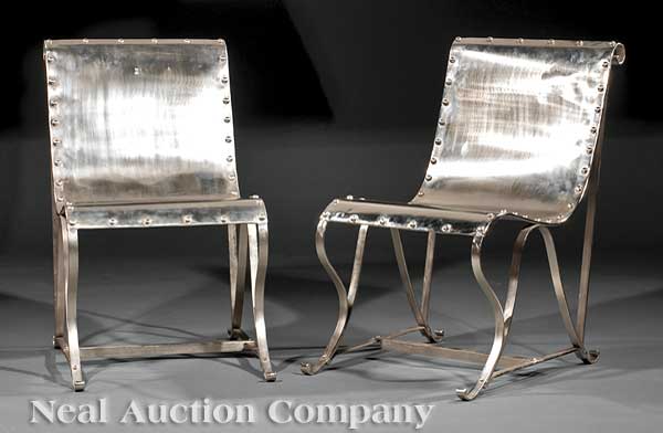 A Pair of Polished Steel Sling Chairs