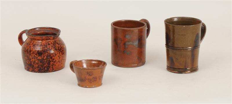 THREE REDWARE MUGS AND A CREAM JUG Comprising