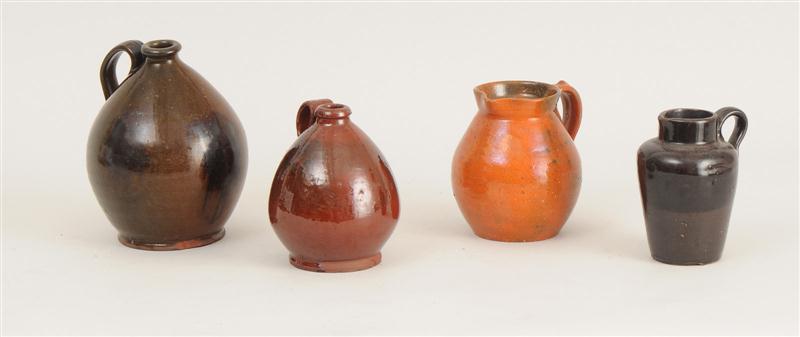 FOUR REDWARE JUGS Comprising three ovoid