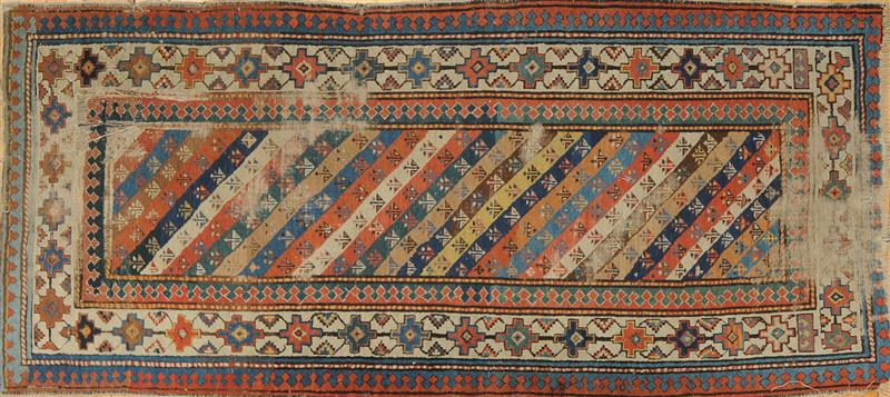 CAUCASIAN RUG AND AN IVORY-GROUND