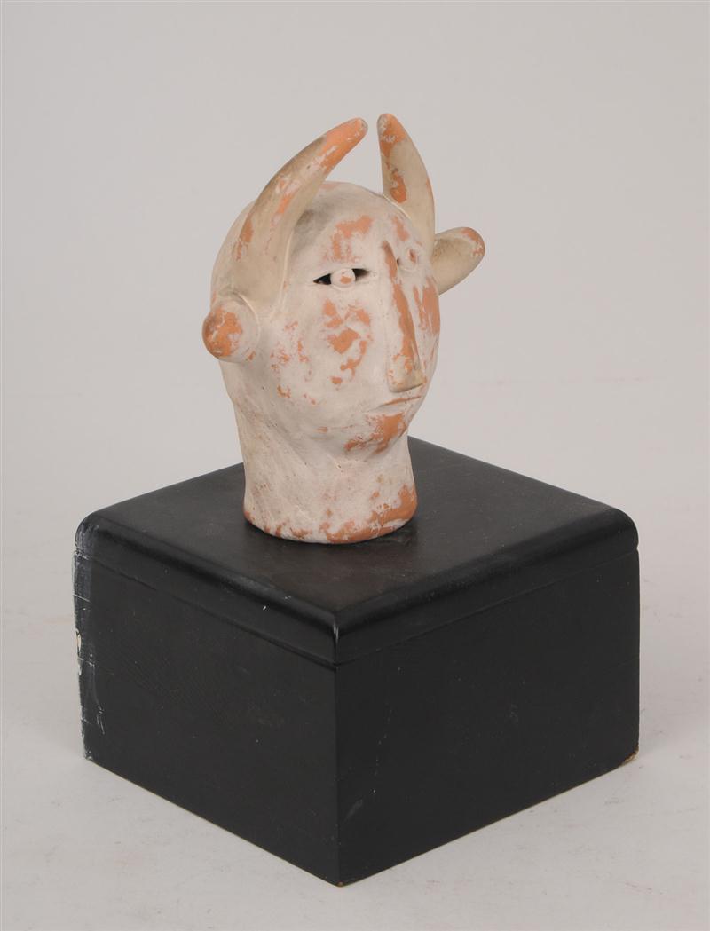 TERRACOTTA OF A DEVIL With traces 140cce