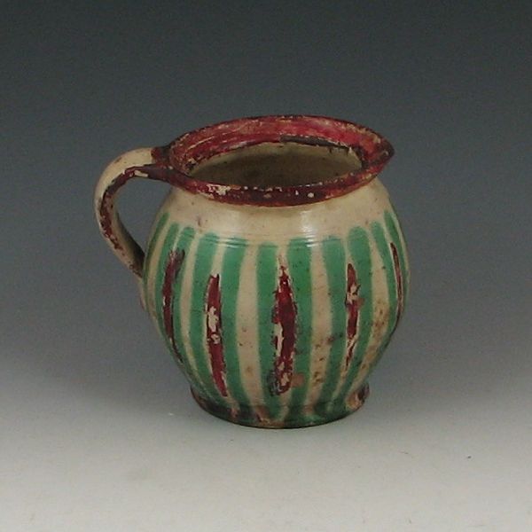 Decorated Pitcher tan green and red