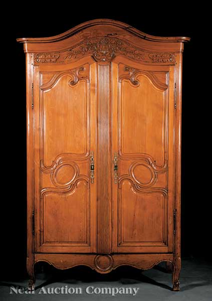 A Louis XV Carved Pine Armoire