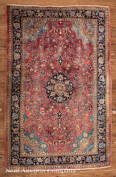 A Persian Kashan Carpet rose ground
