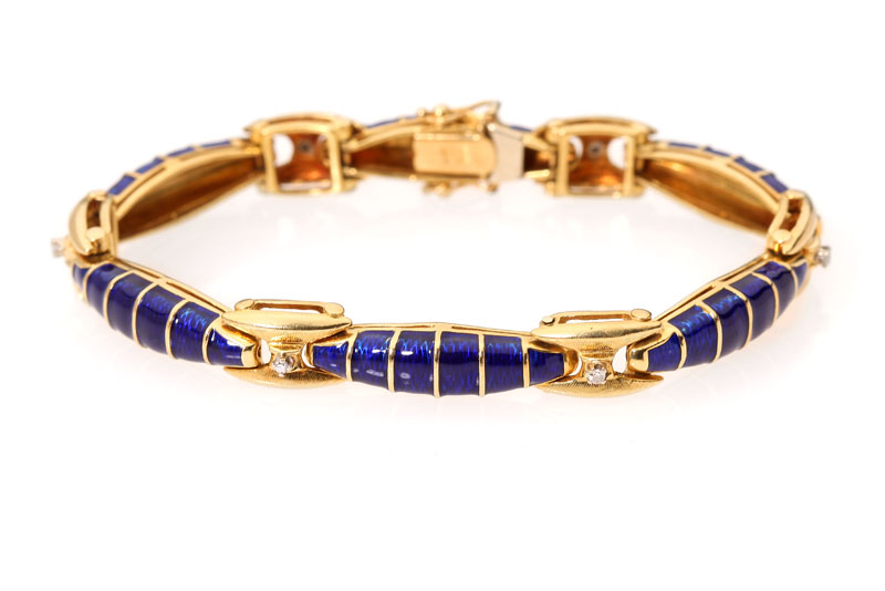 An 18K yellow gold and blue enamel 1428e6