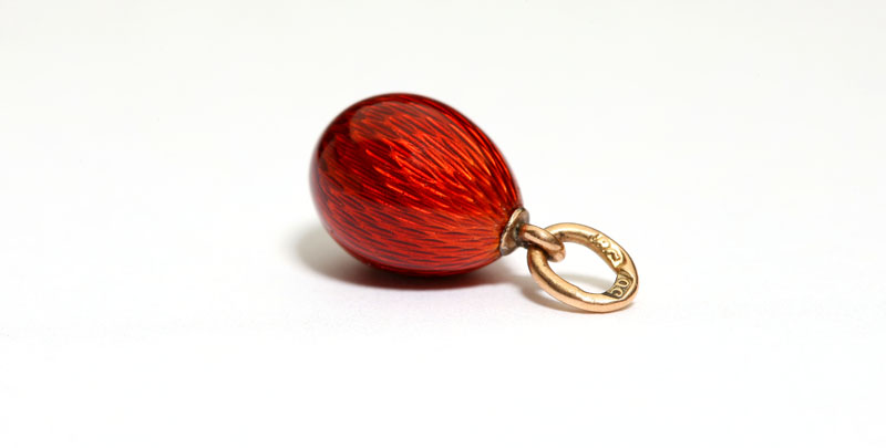 A Faberge red guilloche egg pendant