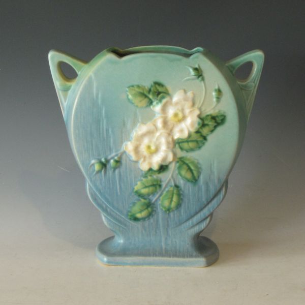 Roseville White Rose vase in blue.