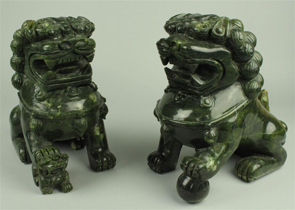 PAIR OF DARK HARDSTONE BUDDHISTIC LIONS