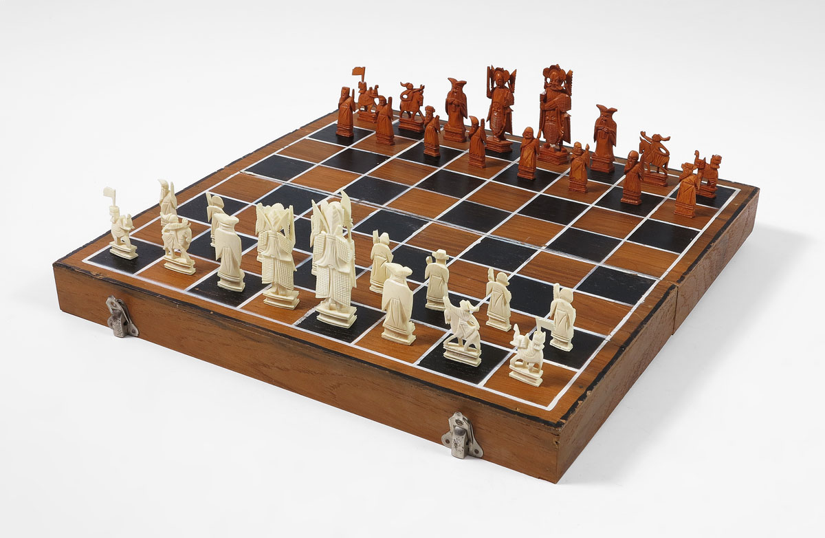 CHINESE CARVED IVORY CHESS SET: