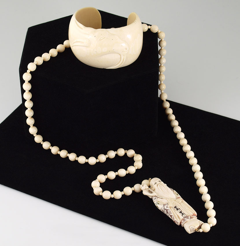 CARVED FIGURAL IVORY NECKLACE AND BRACELET: