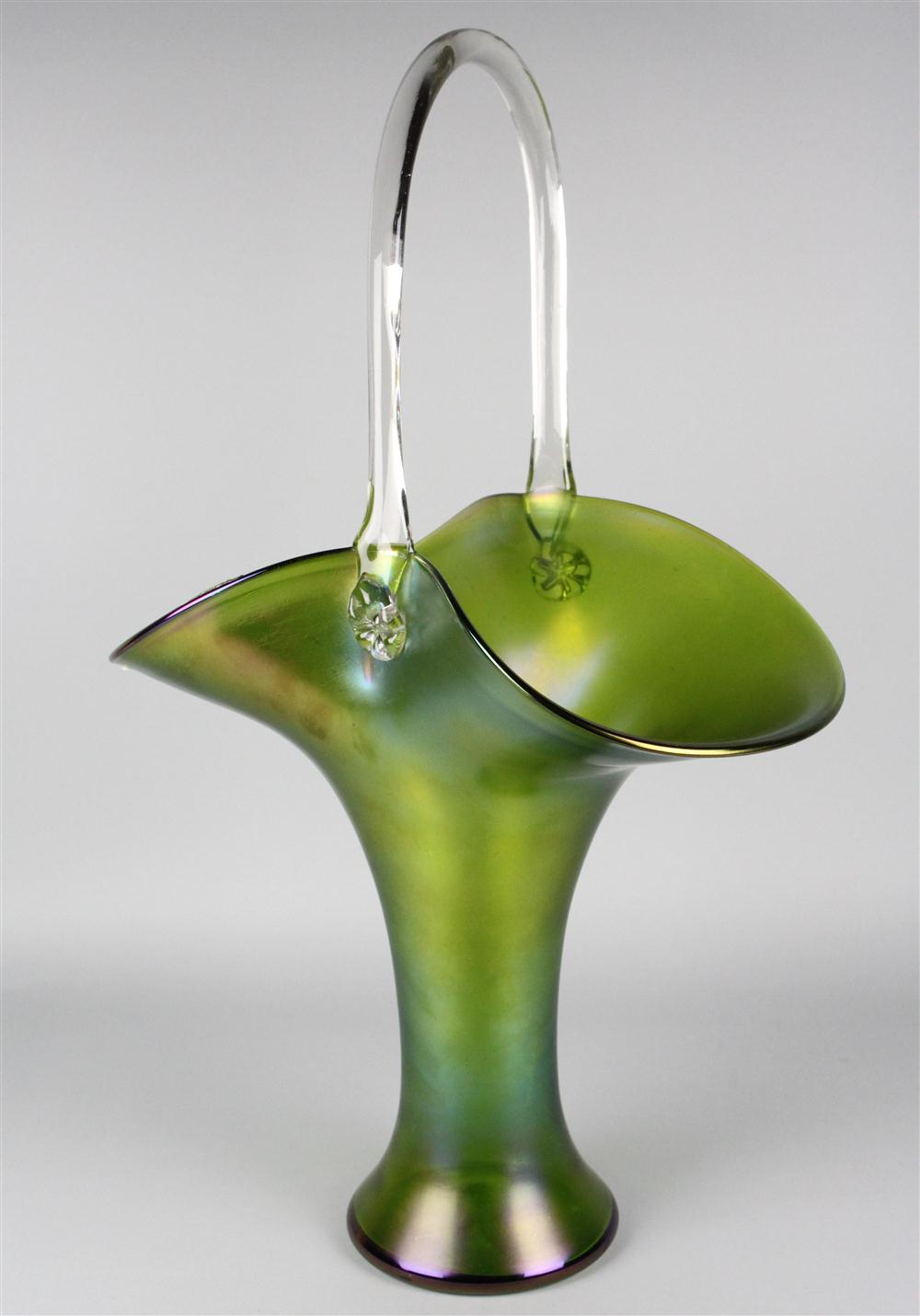 A MASSIVE IRIDESCENT GREEN GLASS BASKET