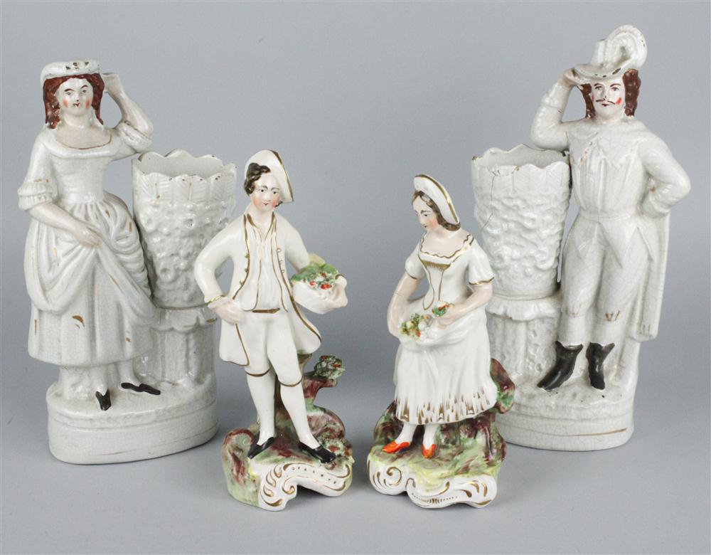 A PAIR OF STAFFORDSHIRE FIGURAL SPILL