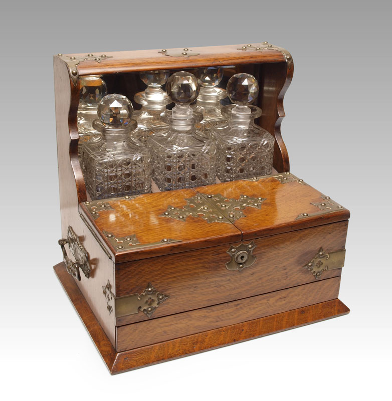 VICTORIAN OAK TANTALUS WITH 3 BOTTLES  1464ee