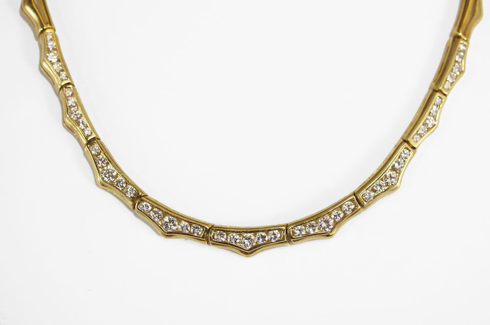 18K GOLD AND DIAMOND WAVE NECKLACE: