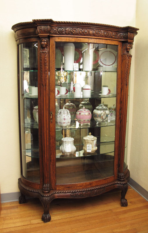 CARVED OAK TRIPLE BOW FRONT CHINA