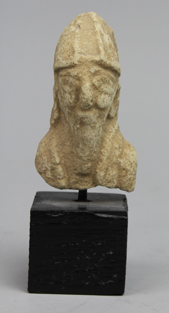 A SMALL POTTERY BUST POSSIBLY PHARAONIC